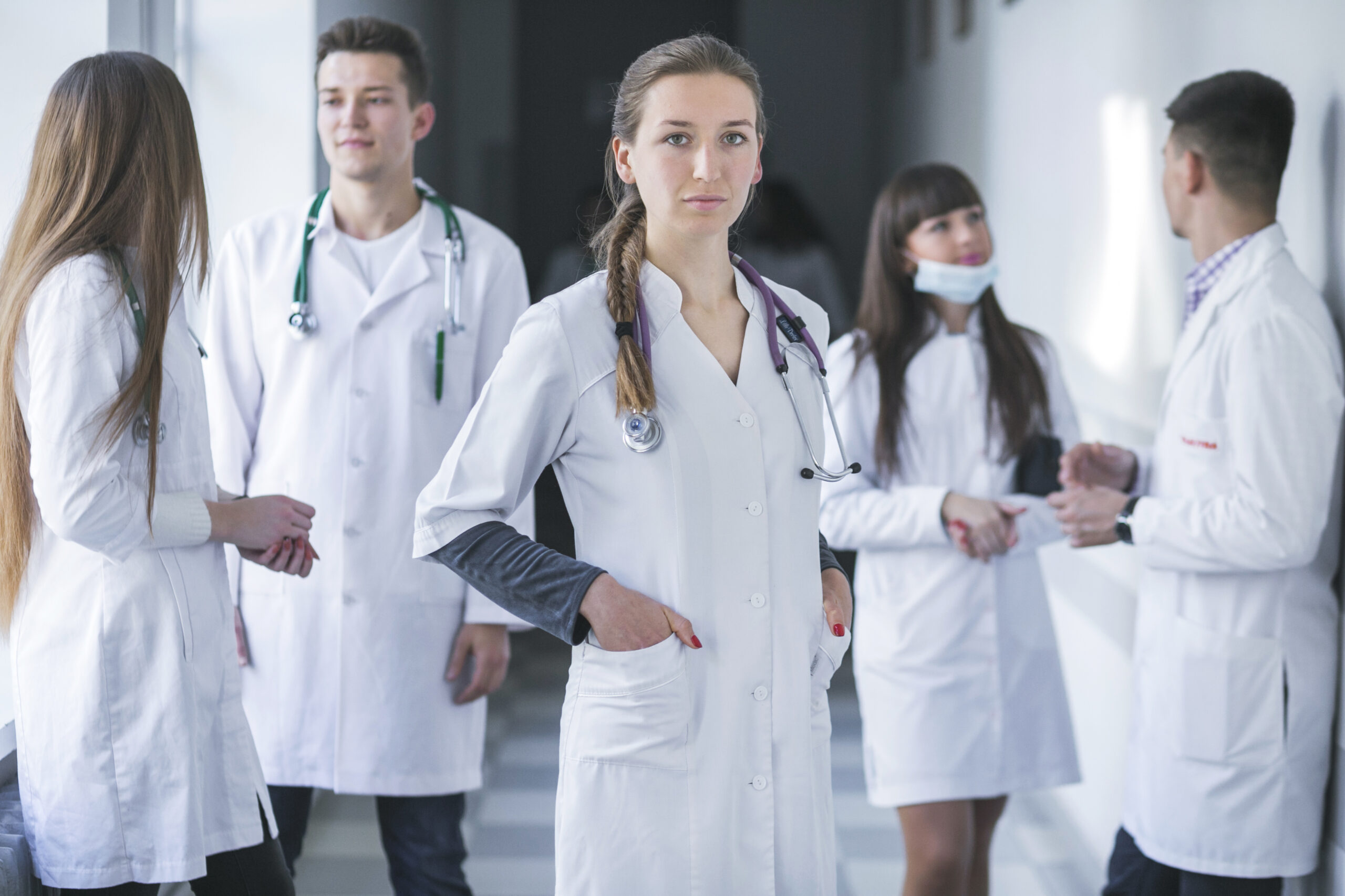 woman standing with medic colleagues
